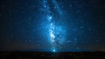 Stunning night sky showcasing the Milky Way with a bright star in the foreground over a desert landscape