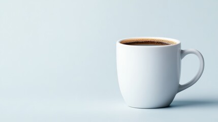 Obraz premium A simple yet elegant white coffee mug filled with brown coffee sits calmly in a soft light background, evoking feelings of peace, relaxation, and minimalism.