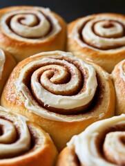 Fototapeta premium Cinnamon rolls with glazed icing, warm and inviting