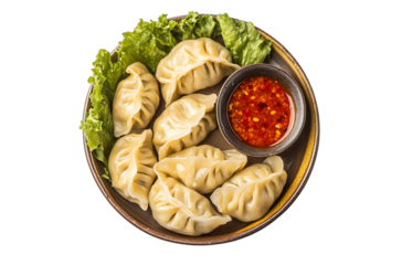  momo, veg or non veg in red and cream sauce, served with sauce.  Nepal and Tibet recipe