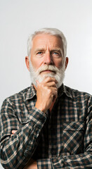 Obraz premium Thoughtful Senior Man with White Beard in Plaid Shirt