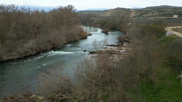 Ebro River among the vineyards in the Rioja Valley, Spain. Aerial shot with drone