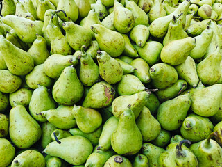 A pile of fresh delicious ripe pears open sell in Indian market.