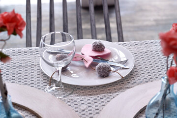 modern Easter table setting with pink felt bunnies on white plates