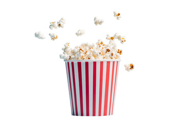 Popcorn in red and white striped bucket with flying pieces, cut out transparent