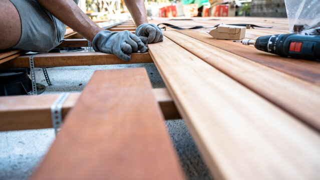 Installing wooden deck boards with hidden fasteners