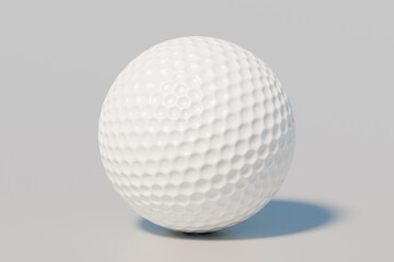 A closeup of a white golf ball on a neutral background