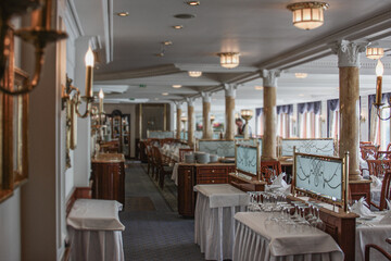 Formal and elegant ocean view dining room restaurant onboard luxury cruiseship or cruise ship liner...