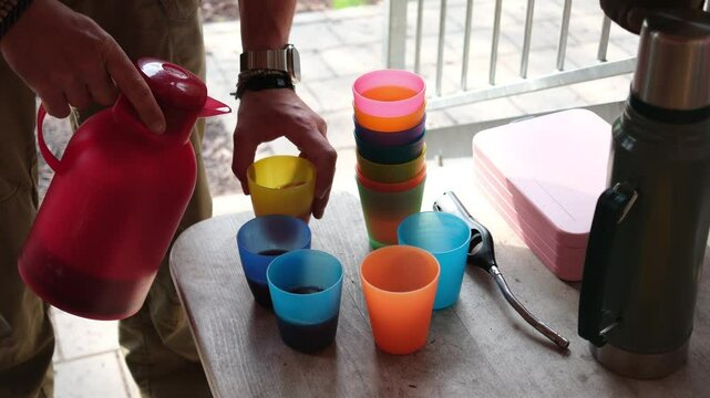 Birthday Preparation with Cups and Cake Outdoors