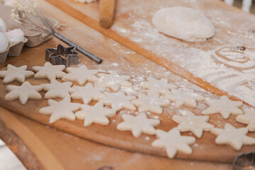 Star shaped raw cookies ready to bake. Baking sheet uncooked biscuits homemade cakes and...