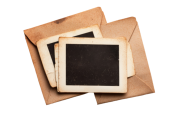 Collection of vintage photographs in brown envelopes with empty frames