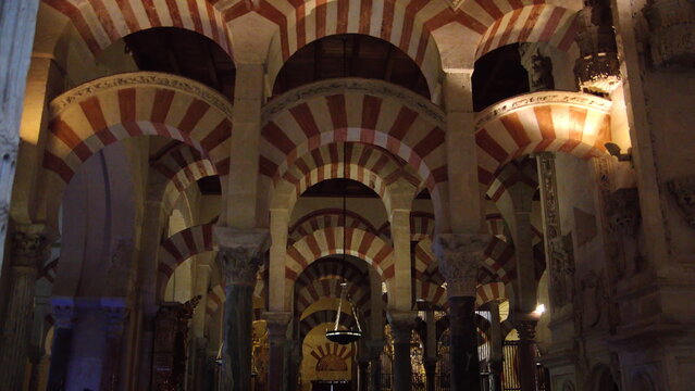 Columns and red and white arches supporting the ceiling in the Mosque-Cathedral of Cordoba, in the historic center of Cordoba, Spain