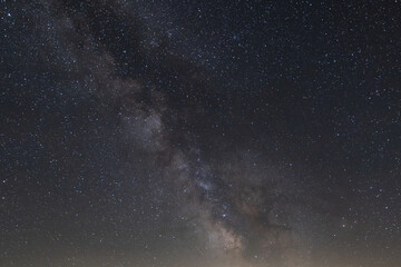 Fototapeta premium Clear skies with milky way and shooting star at Limmerensee, Canton Glarus in Switzerland.