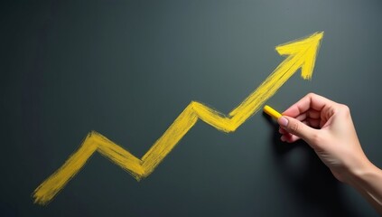 Changing business management concept. Businessman drawing yellow arrow on chalkboard