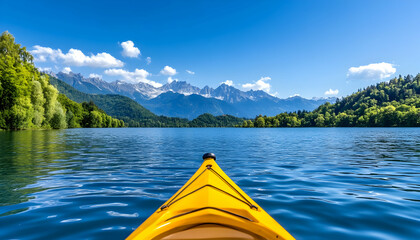 Serene kayaking view; mountains, lake, and vibrant yellow kayak