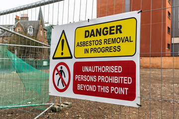 Construction Site Attention Danger Asbestos Removal and Demolition in Progress Sign on Temporary...
