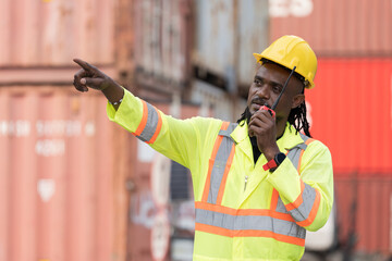 Import and export container, Worker inspecting and control of container. Male worker working and managing container at container yard