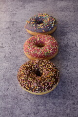 Three colorful donuts