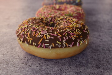 Three colorful donuts