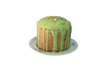 sweet Kulich bread with raisin, muffin look, on white porcelain plate. topping are colored nonpareils and sprinkles with sugar stars on green melted sugar glaze. isolated on white background