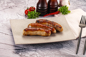 Delicous natural roasted sausages in the plate