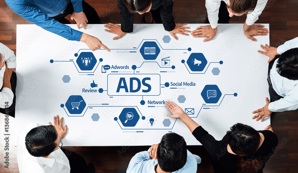 Poster a diverse team collaborates in a modern workspace, focusing on advertising strategies and social med