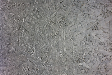 OSB or Oriented Strand Board Wood Panel Painted Industrial Gray Close-Up for Background or Graphic Design