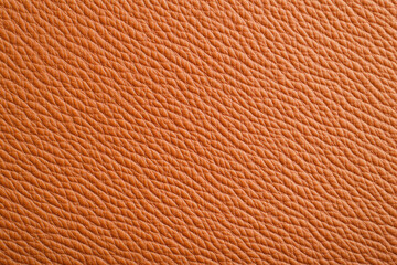 Warm, inviting, textured orange leather, a luxurious tactile experience.