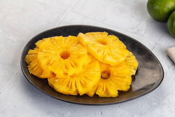 Sweet canned pineapple slices in syrope
