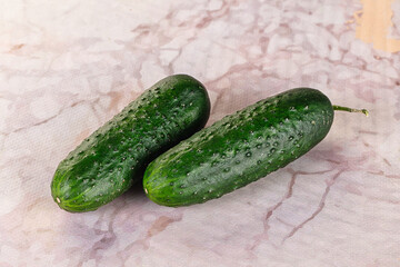Ripe green raw two cucumbers