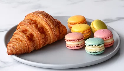 Croissant and Macarons on Plate.
