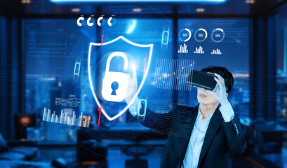 Project manager pointing security system hologram and standing at futuristic office with blue...