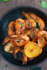 Marinated shrimp in a spicy grill with lime and garlic. Delicious fresh seafood, Mediterranean cuisine.