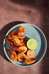 Marinated shrimp in a spicy grill with lime and garlic. Delicious fresh seafood, Mediterranean cuisine.
