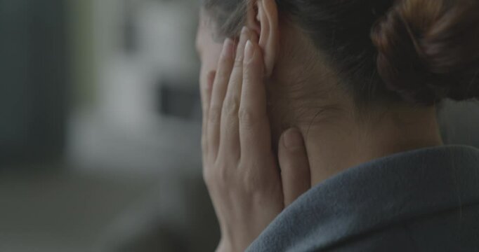Young woman with ear pain