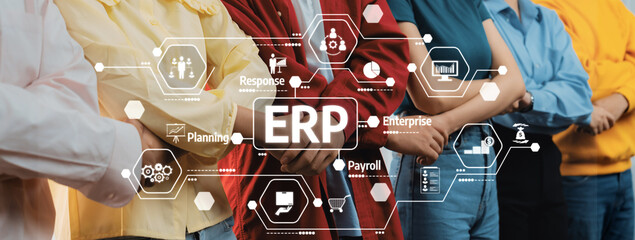 Diverse Team Collaborating on ERP Solutions with Visual Data Presentation in Professional Setting. Amity