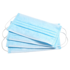 Fototapeta premium A neat stack of three blue surgical masks with white ear loops ready for use Ideal for healthcare pandemic and hygiene concepts