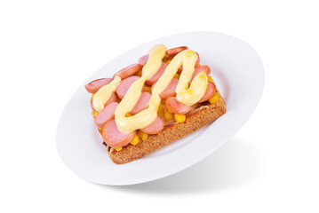 Cheese corn sausages baked sandwich in a plate on a white isolated background