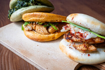 Bao buns breads with chicken,meat and mushrooms close-up	