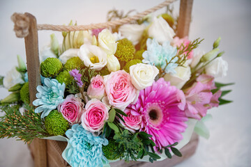 Bouquet of fresh flowers in a basket