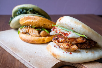 Bao buns breads with chicken,meat and mushrooms close-up	