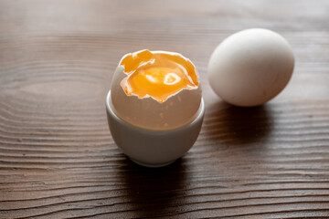 broken egg on wooden background