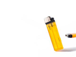 orange cigarette gas lighters on white