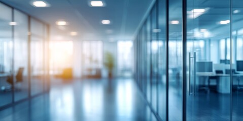 This modern office space features stunning glass walls that allow for abundant natural light, creating an inviting atmosphere ideal for collaboration and productivity among professionals and teams