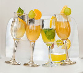 Colored cocktails with fruits in a glass glass.