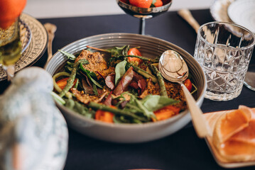 Colorful salad served in a bowl with fresh ingredients on a table setting