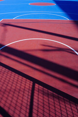 blue and red street basketball court on the street
