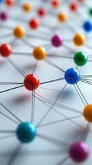 Colorful spherical nodes connected by threads in a vibrant network design on a white surface
