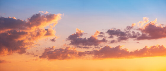 Background Panorama of beautiful sky at sunset with clouds glowing
