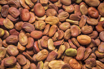 Background image covered with dried broad beans